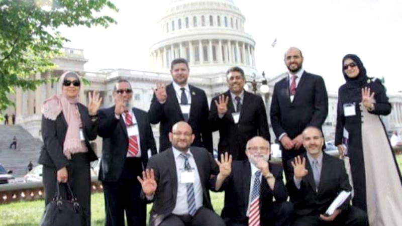 قيادات الإخوان بكرافتة العلم الأمريكى